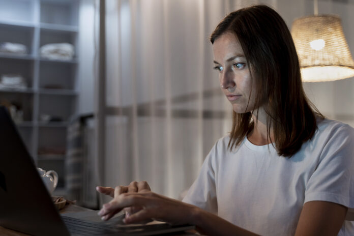 close-up-person-working-home-night